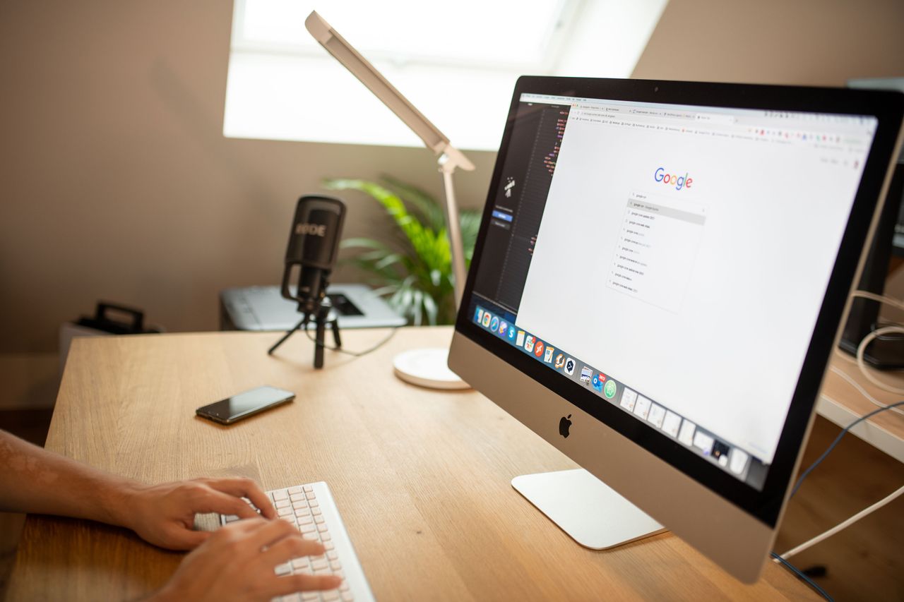 Mastering the First Impression: Your intriguing post title goes here A modern workspace with an iMac displaying Google search, perfect for remote work setups.